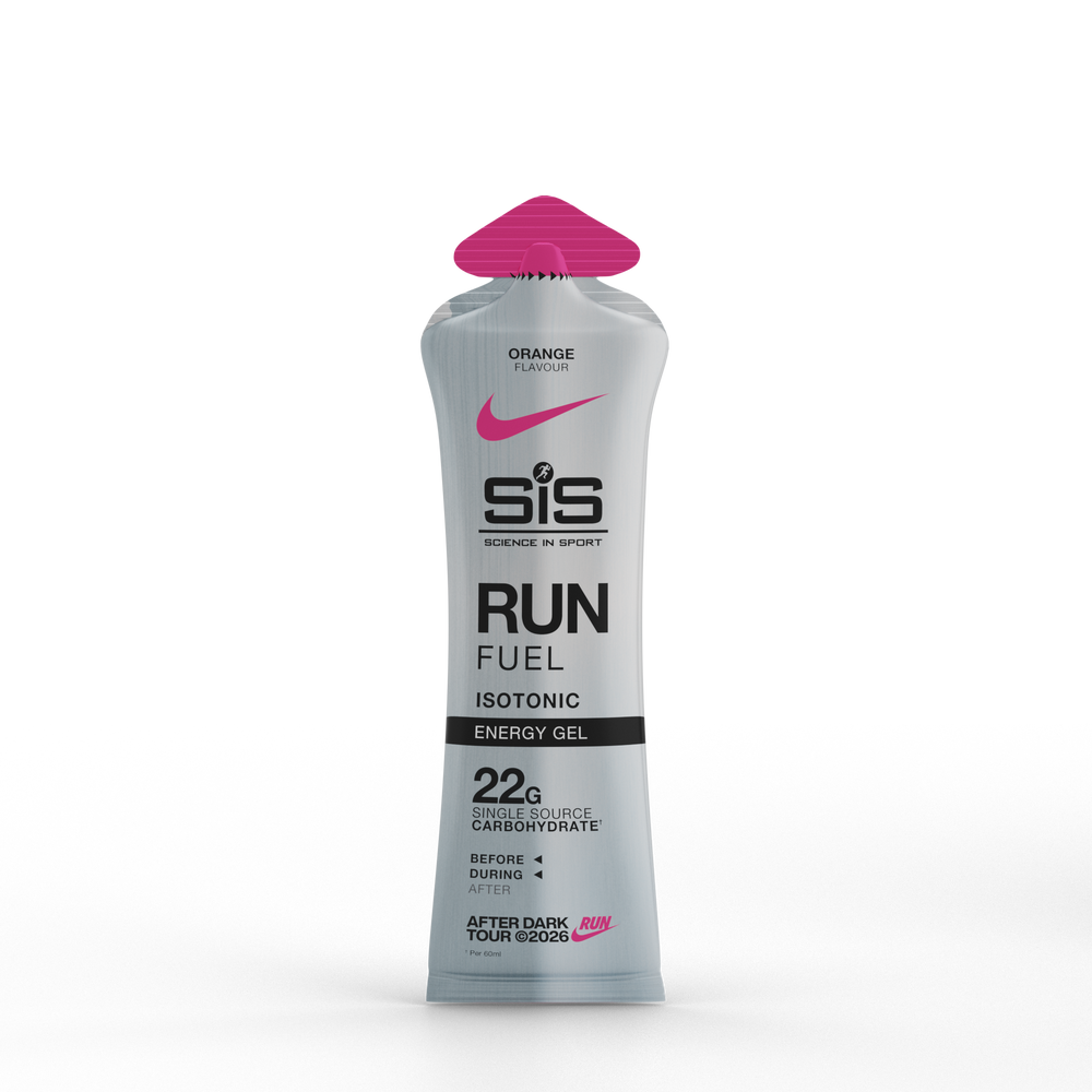 A squeeze tube of SIS Running in Sport Run Fuel Isotonic Energy Gel in pink grapefruit flavor, featuring a metallic silver body, black text, and a bright pink cap, set against a plain white background.