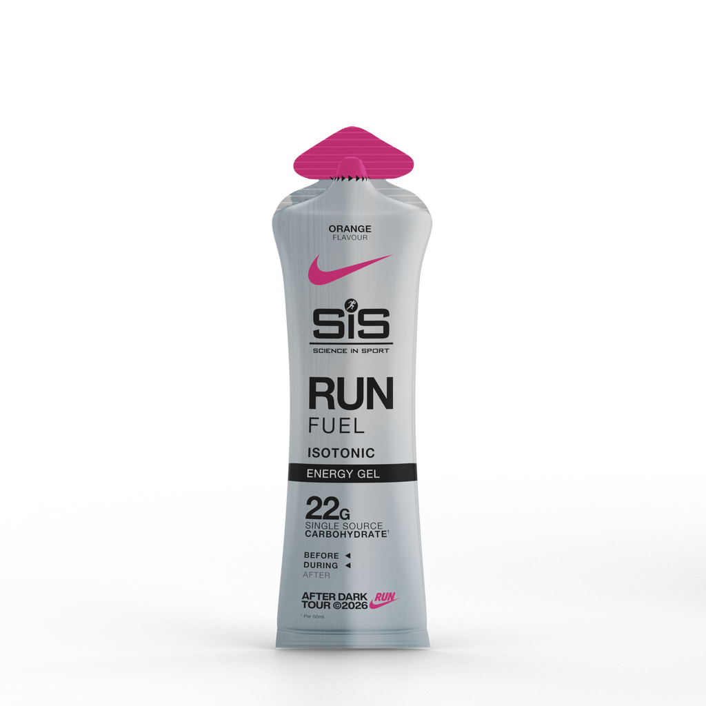 A squeeze tube of SIS Running in Sport Run Fuel Isotonic Energy Gel in pink grapefruit flavor, featuring a metallic silver body, black text, and a bright pink cap, set against a plain white background.